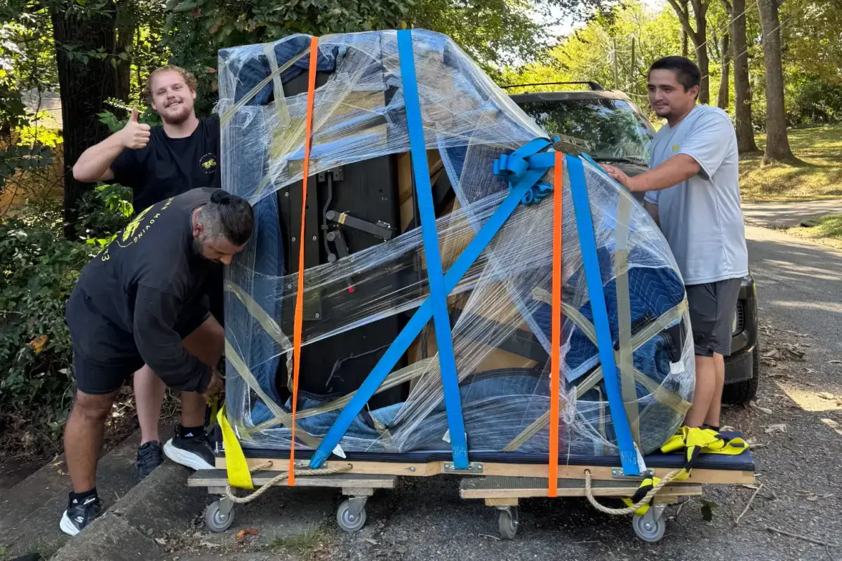 McMinn Moving N More crew moving a grand piano in Cleveland, TN